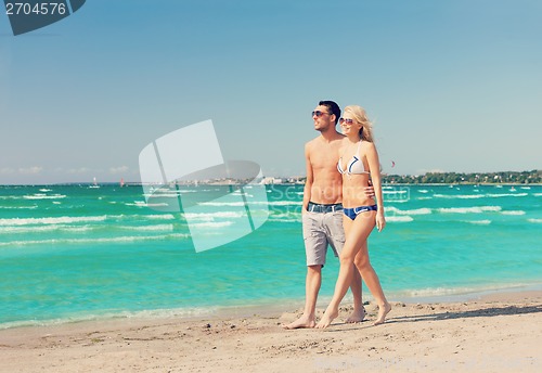 Image of couple walking on the beach