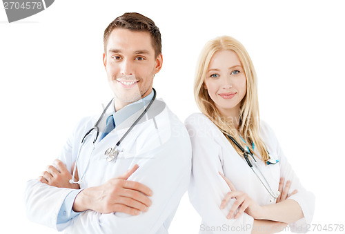 Image of young male doctor and female nurse in hospital