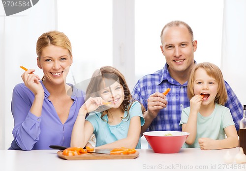 Image of happy family with two kids eating at home