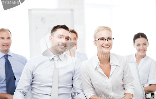 Image of businessmen and businesswomen on conference