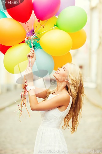 Image of woman with colorful balloons