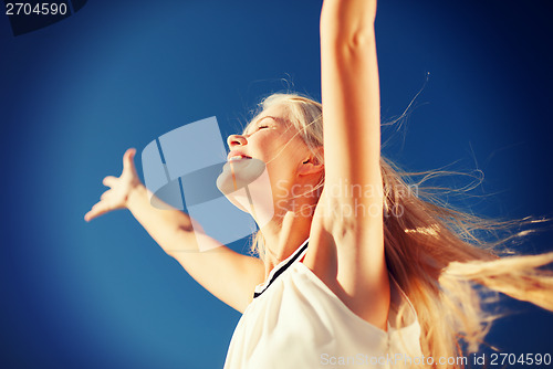 Image of beautiful woman enjoying summer outdoors