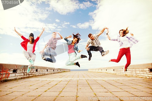 Image of group of teenagers jumping