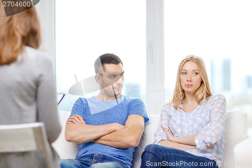 Image of young couple with a problem at psychologist office