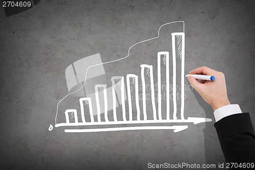 Image of close up of businessman drawing growing graph