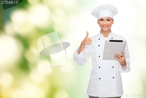 Image of smiling female chef with tablet pc computer