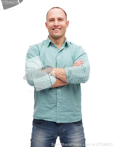 Image of smiling man with crossed arms