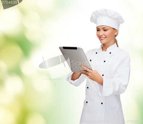 Image of smiling female chef with tablet pc computer