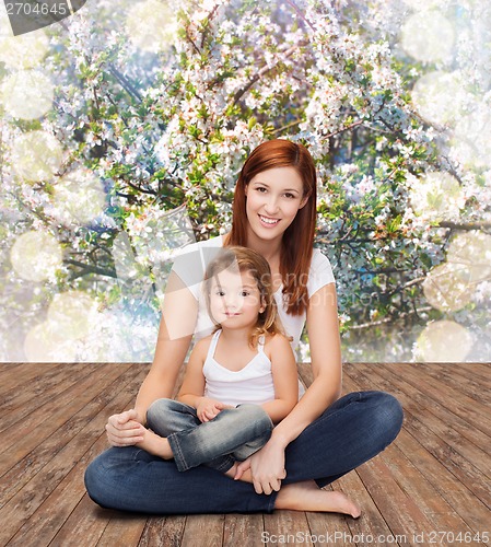 Image of happy mother with adorable little girl