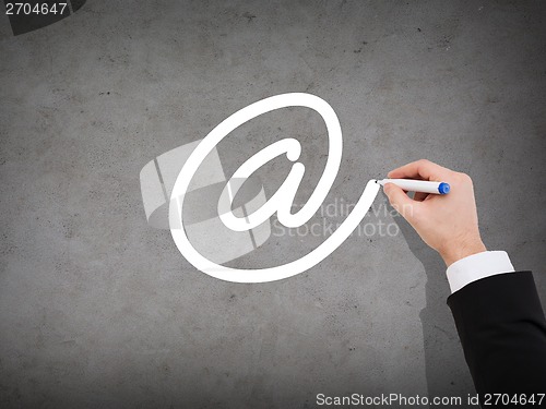 Image of close up of businessman drawing e-mail sign