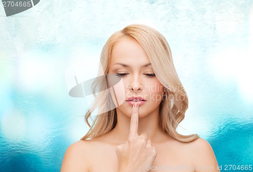 Image of woman touching her lips