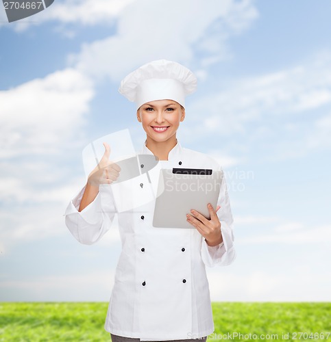 Image of smiling female chef with tablet pc computer