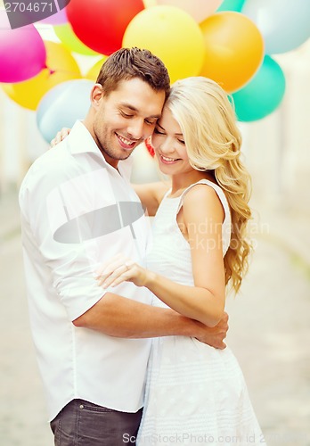 Image of couple with colorful balloons