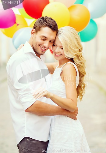 Image of couple with colorful balloons