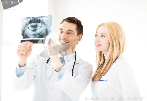 Image of two doctors looking at x-ray