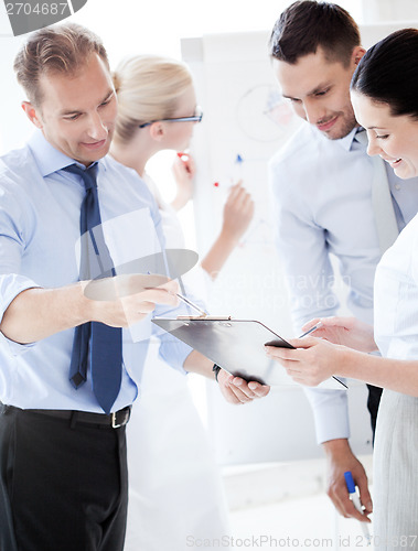 Image of business team having discussion in office