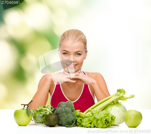 Image of smiling sporty woman with organic food