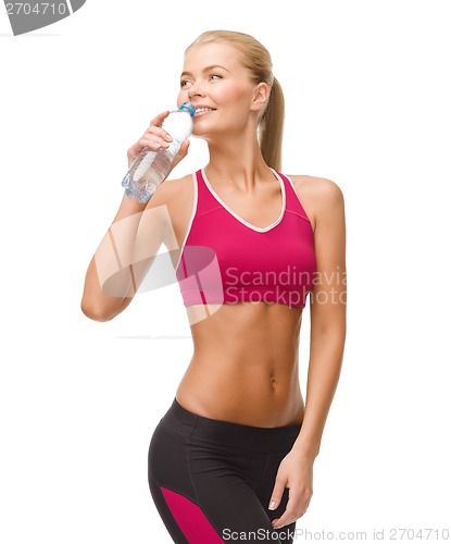 Image of smiling woman with bottle of water