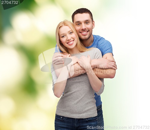 Image of smiling couple hugging