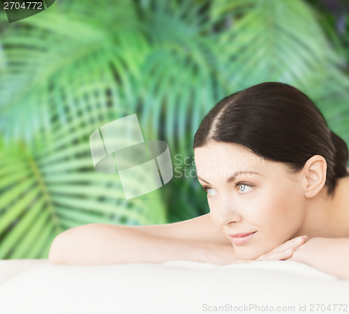 Image of smiling woman in spa salon