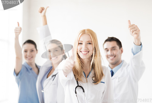 Image of group of doctors showing thumbs up