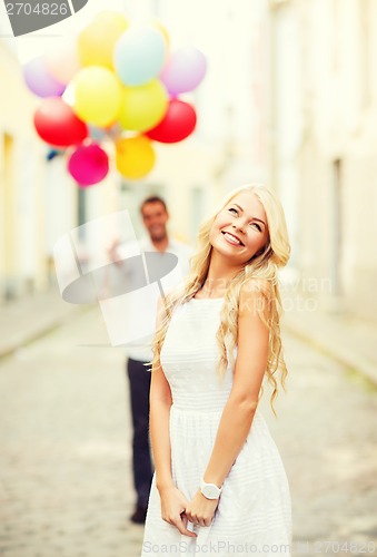 Image of couple with colorful balloons