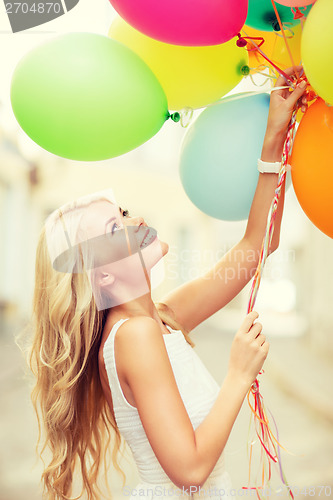 Image of woman with colorful balloons
