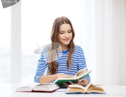 Image of happy smiling student girl with books