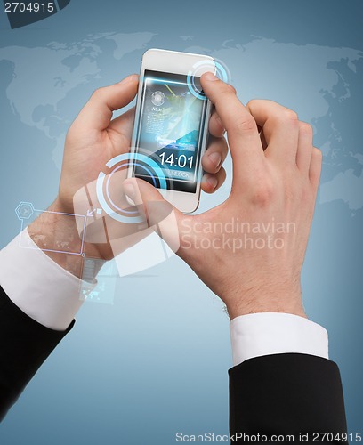 Image of businessman touching screen of smartphone