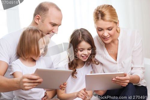 Image of family and two kids with tablet pc computers