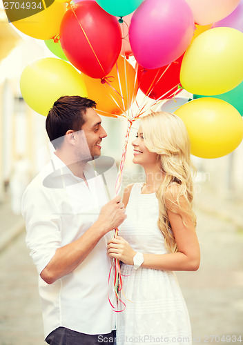 Image of couple with colorful balloons