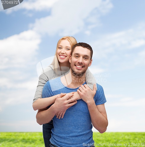 Image of smiling couple hugging