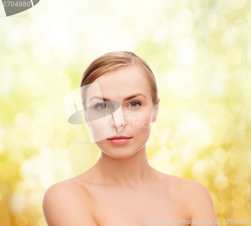 Image of face and shoulders of young woman