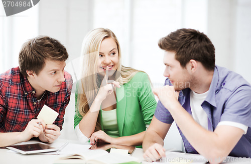 Image of group of students gossiping at school