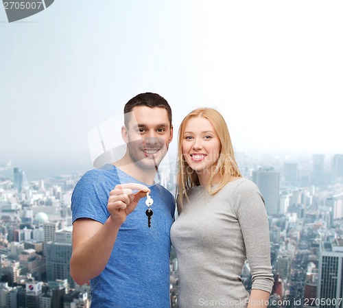 Image of smiling couple holding keys