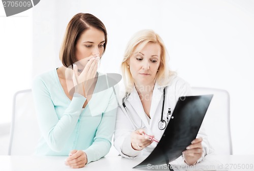 Image of doctor with patient looking at x-ray