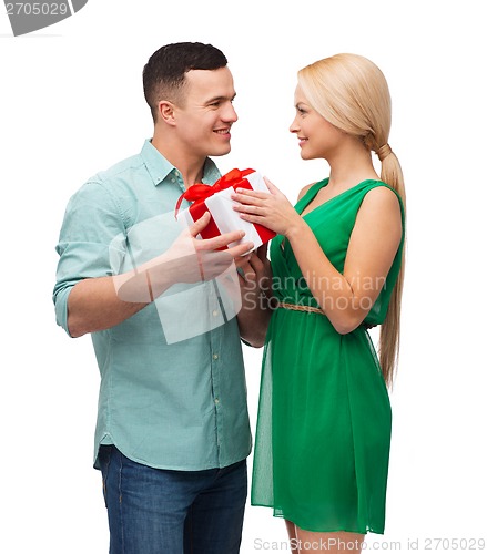 Image of smiling couple with gift box