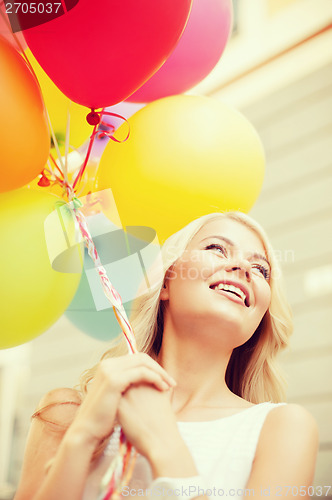 Image of woman with colorful balloons