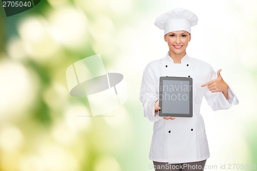 Image of smiling female chef with tablet pc blank screen