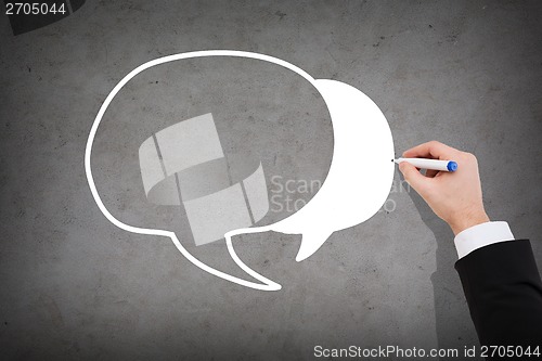 Image of close up of businessman drawing message