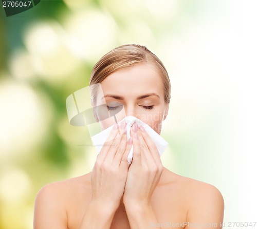 Image of beautiful woman with paper tissue