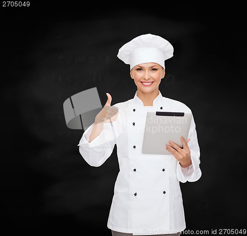 Image of smiling female chef with tablet pc computer