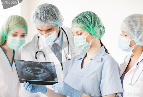 Image of young group of doctors looking at x-ray