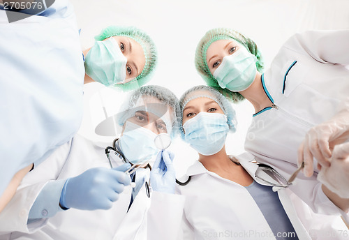 Image of group of doctors in operating room