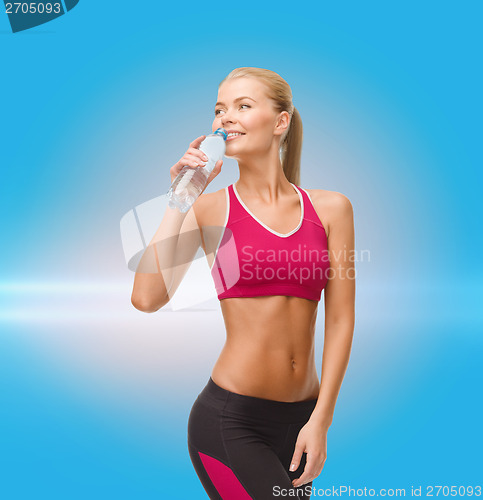 Image of smiling woman with bottle of water