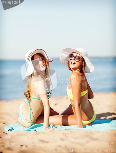 Image of girls sunbathing on the beach