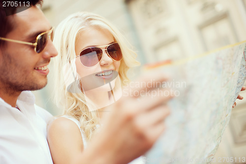 Image of couple with map in the city