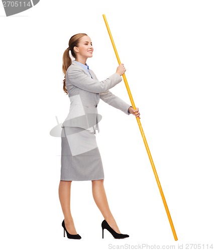 Image of smiling woman holding flagpole with imaginary flag