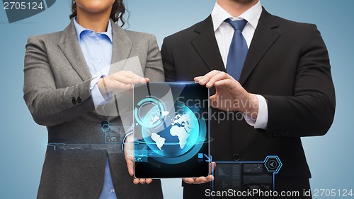 Image of businessman and businesswoman with tablet pc