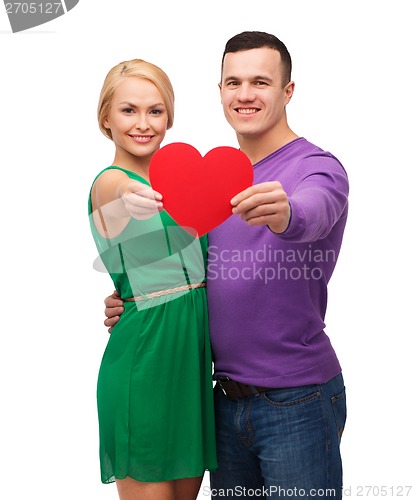 Image of smiling couple holding big red heart